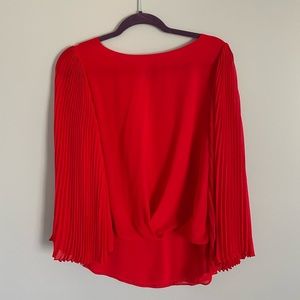 Vince Camuto red shirt with pleated sleeves and bunched front. Size M.